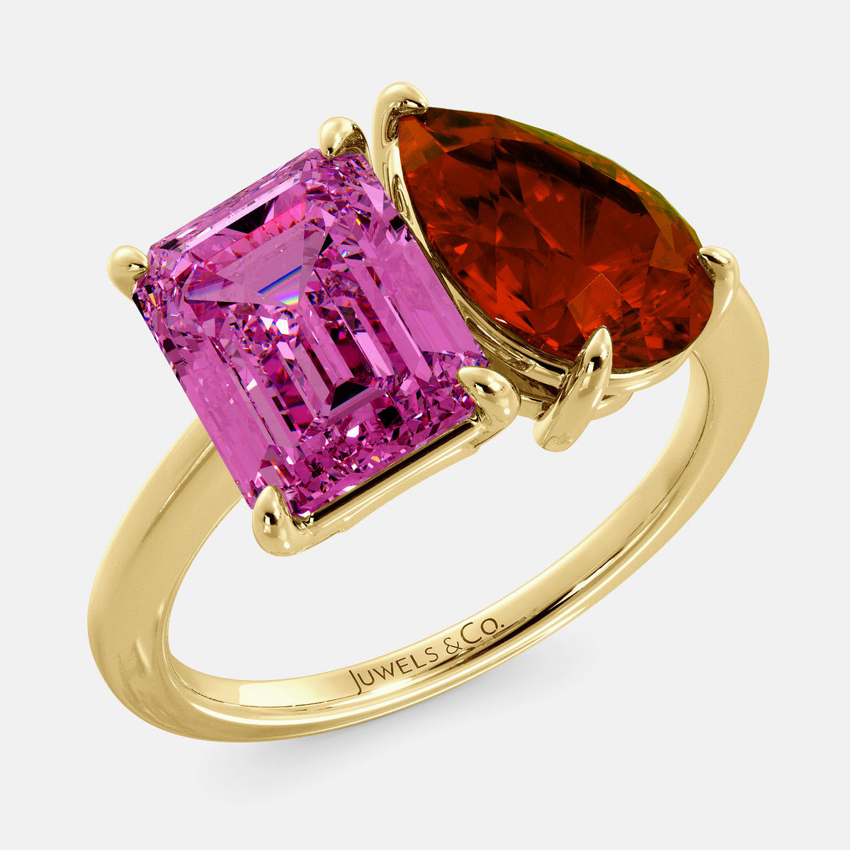 A toi et moi ring with an emerald-cut Pink Sapphire and pear-cut gemstone. The emerald-cut is set on the left of the ring, and the pear-cut gemstone is set on the right. The ring is made of recycled yellow gold and has a simple, elegant design. The pear-cut gemstone can be customized. **Here are some additional details about the image:** * The emerald-cut white Pink Sapphire is a birthstone for October. * The pear-cut gemstone can be customized to any stone of your choice