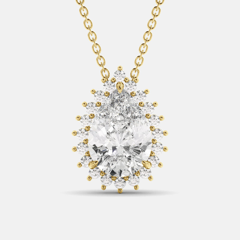 A pear-cut white topaz necklace with a halo of smaller white topaz stones, set in gold.