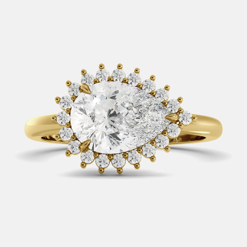 pear cut diamond ring in a halo setting on a white background