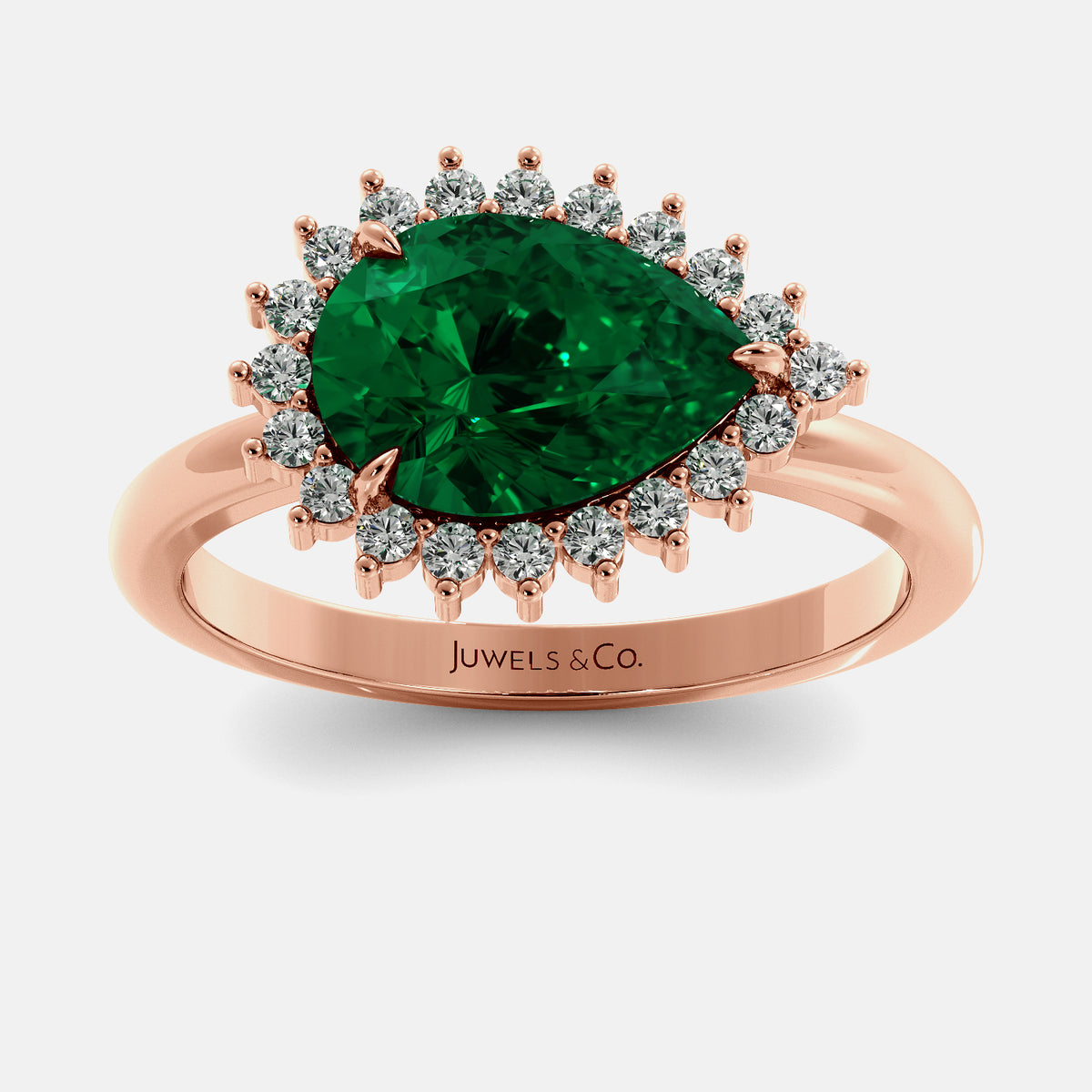Rose gold ring with a green gemstone and diamonds on a white background, featuring the brand 'Juwels & Co'.