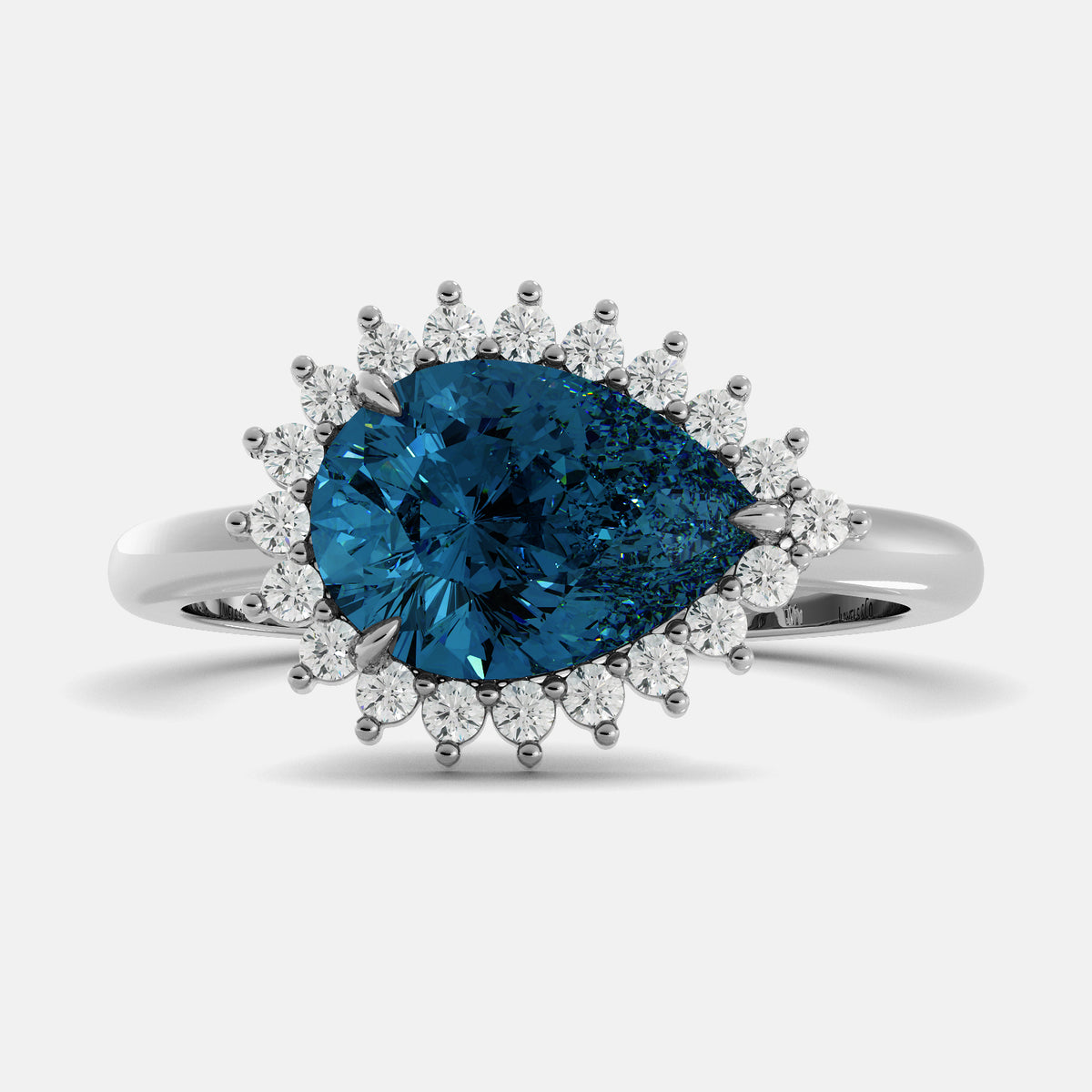 Ring with a blue gemstone and diamond accents on a white background