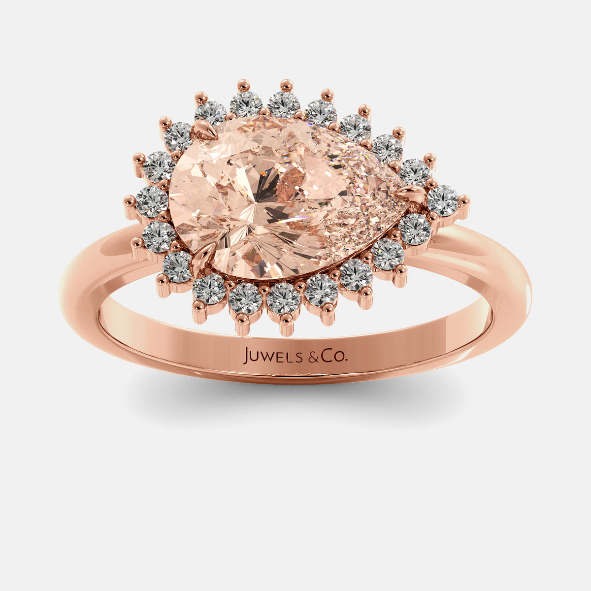 Rose gold ring with a large pink gemstone and smaller diamonds on a white background