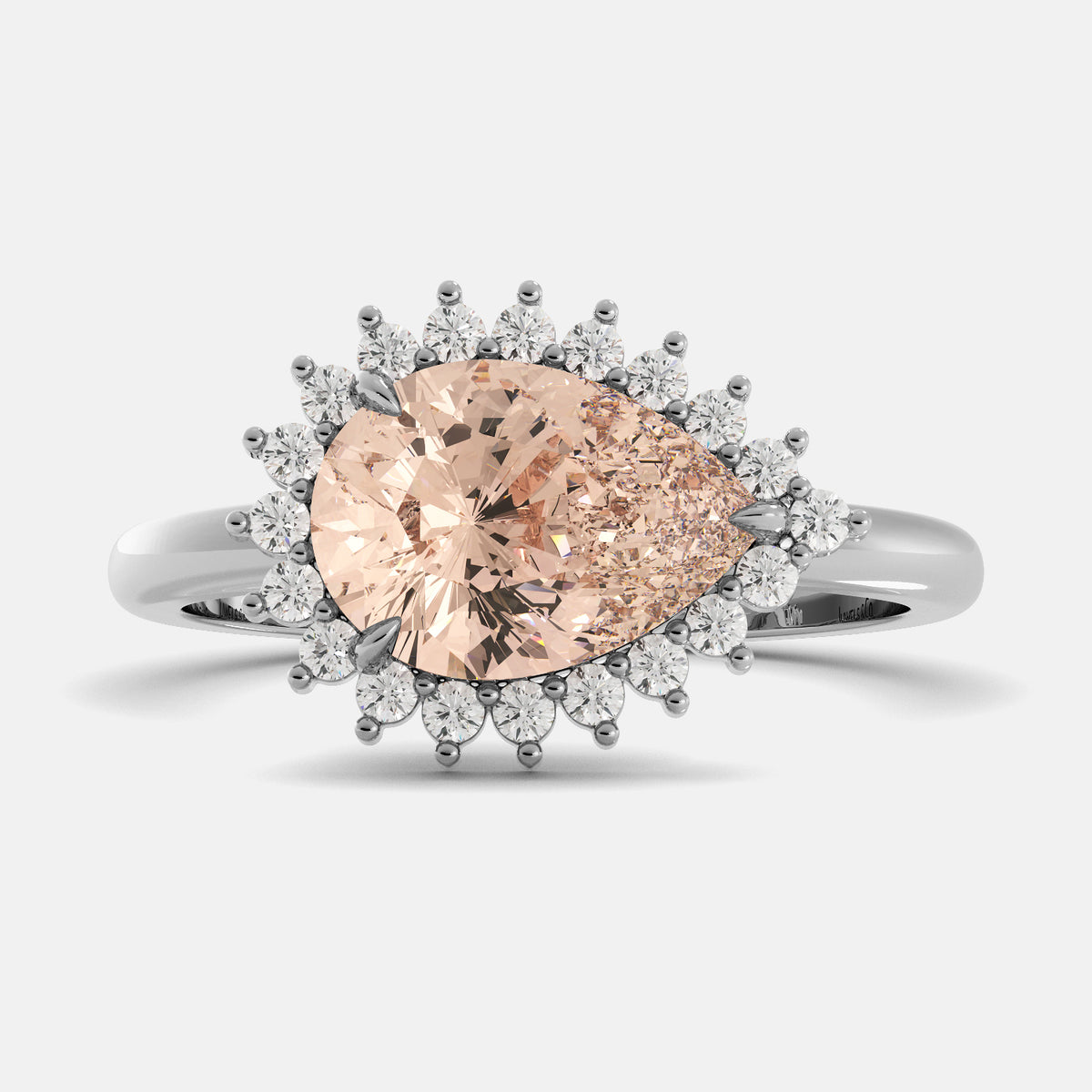 Rose gold pear-shaped diamond ring with white diamond accents on a light gray background