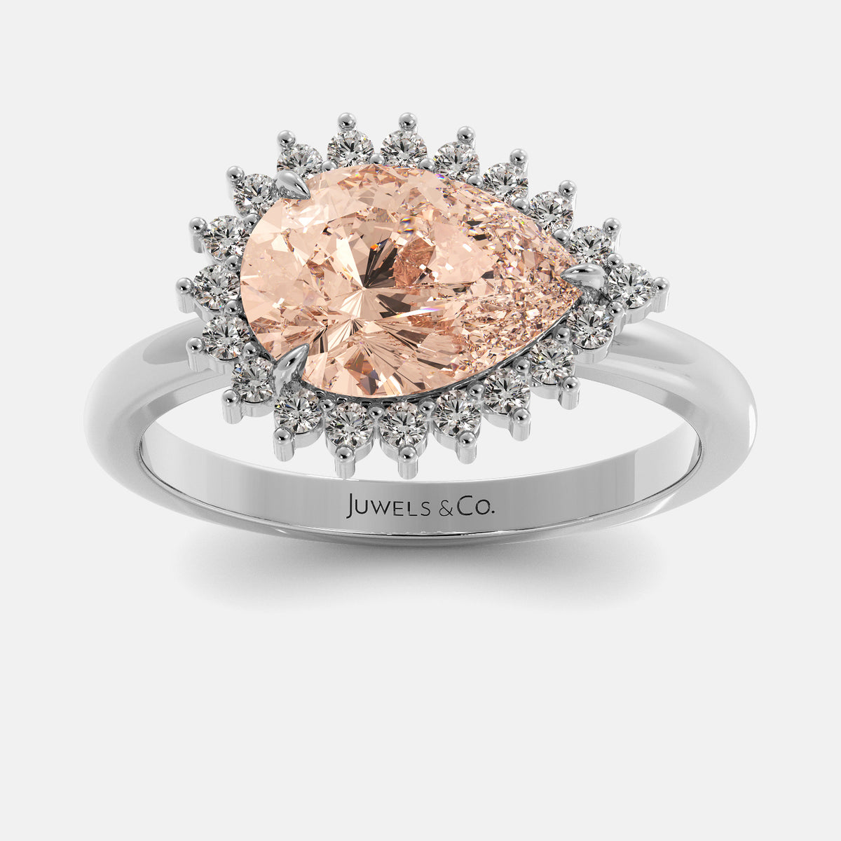 Ring with a pink gemstone and silver halo on a white background, branded 'Juwels & Co'.