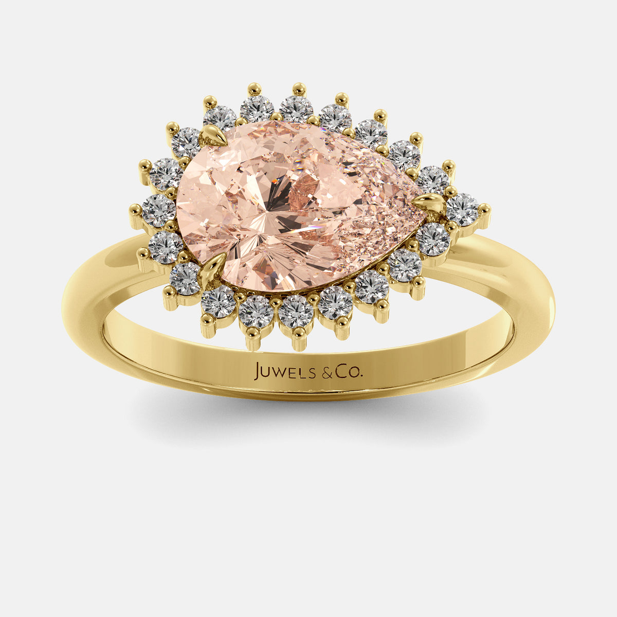 Gold ring with a pink gemstone and 'Juwels & Co.' branding on a white background