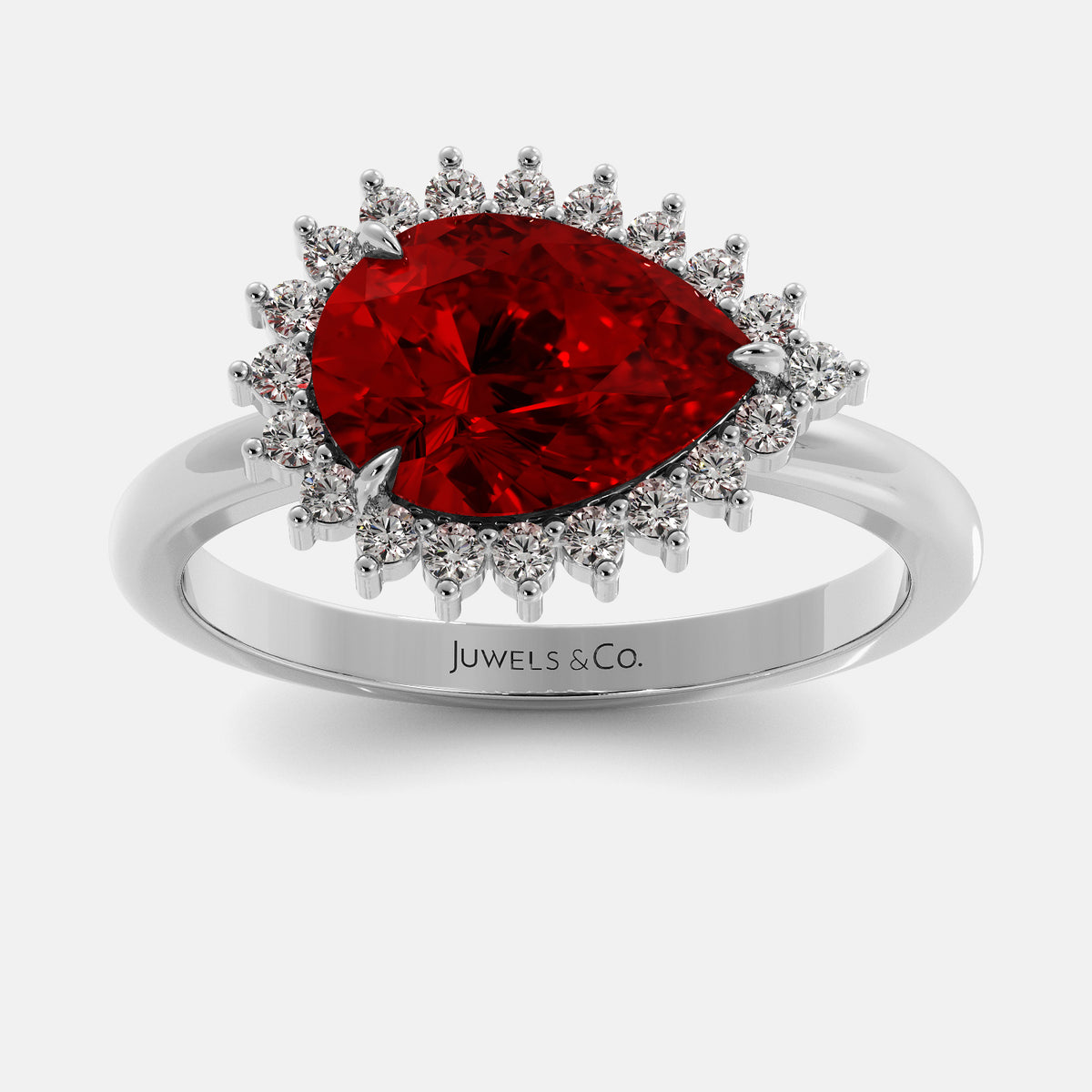 Silver ring with a red gemstone and 'Juwels & Co.' branding on a white background
