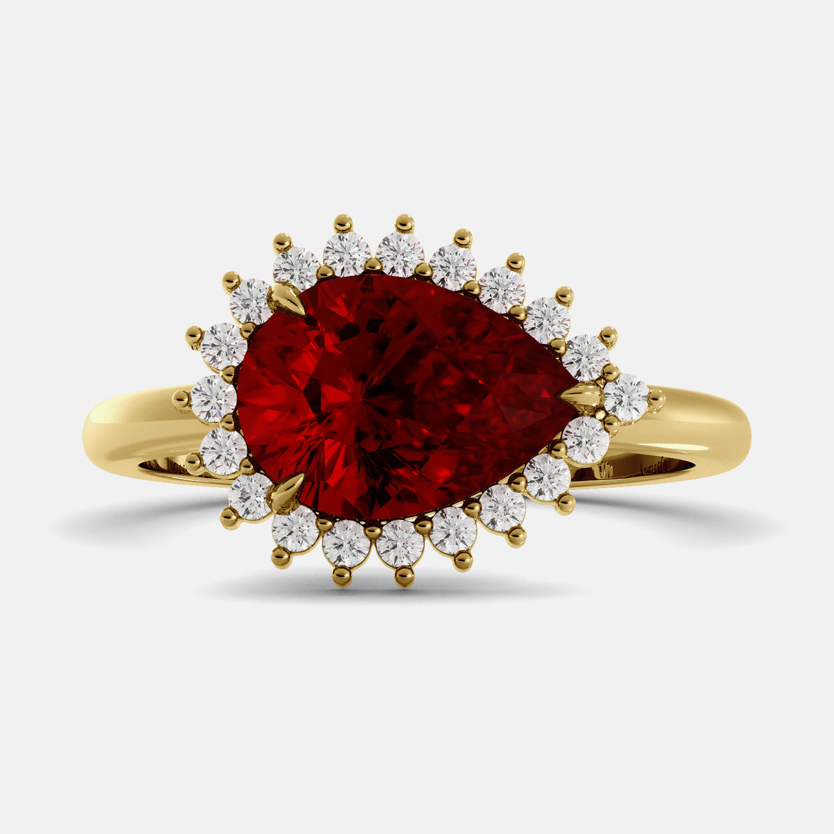 Gold ring with a red gemstone and smaller diamonds on a white background