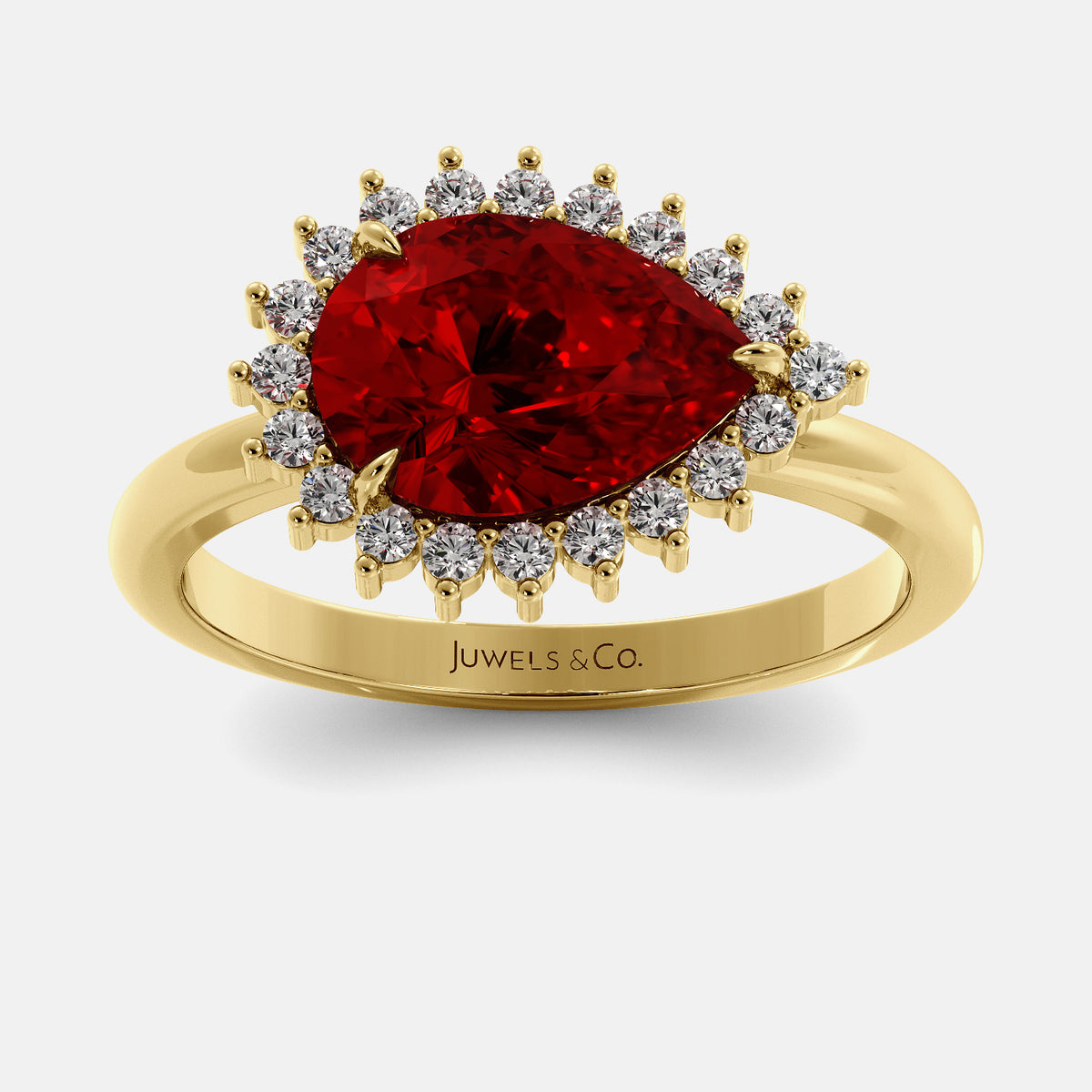 Gold ring with a red gemstone and diamonds on a white background, featuring the brand 'Juwels & Co'.