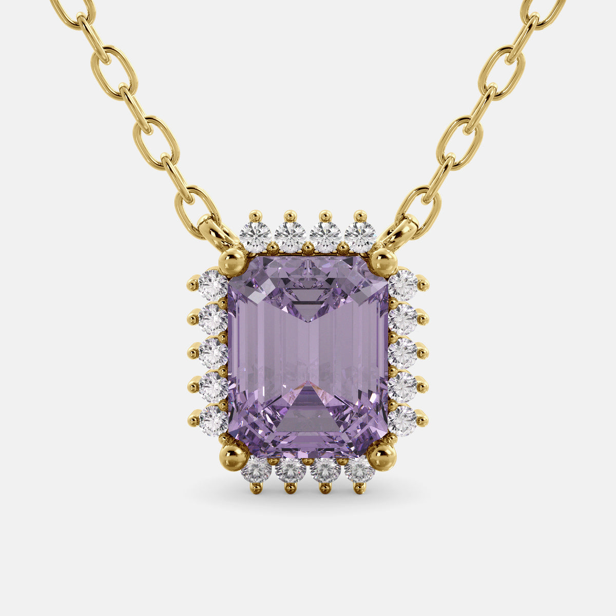 Purple gemstone necklace with gold chain on a white background