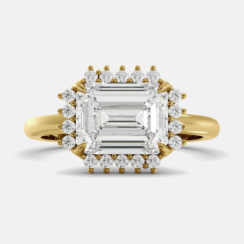 emerald cut diamond ring in a halo setting on a white background