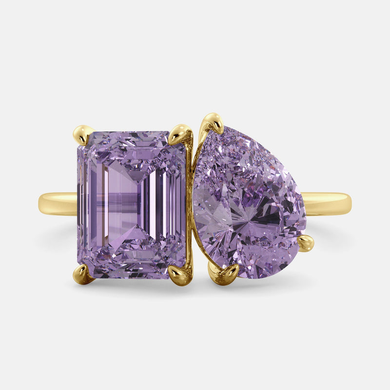 Toi et Moi ring with an emerald-cut Amethyst and a pear-cut Amethyst.