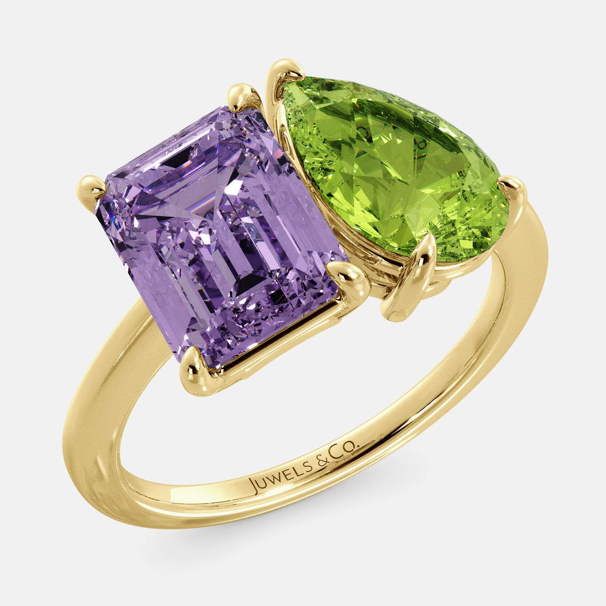 A toi et moi ring with an emerald-cut amethyst and a pear-cut gemstone. The emerald-cut morganite is set on the left of the ring, and the pear-cut gemstone is set on the right. The ring is made of recycled yellow gold and has a simple, elegant design. The pear-cut gemstone can be customized. **Here are some additional details about the image:** * The emerald-cut amethyst is a birthstone for February. * The pear-cut gemstone can be customized to any stone of your choice.