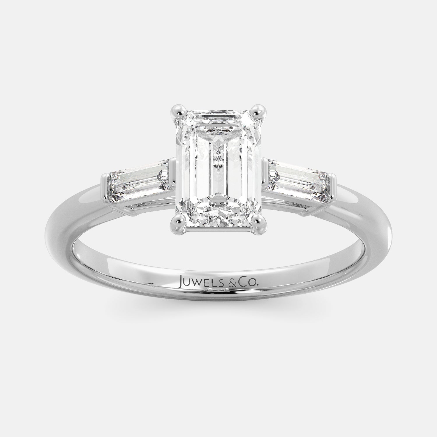 Juwels & Co Emerald Solitaire Diamond Ring With Tapered Baguette Side Stones with white gold 14K Band 