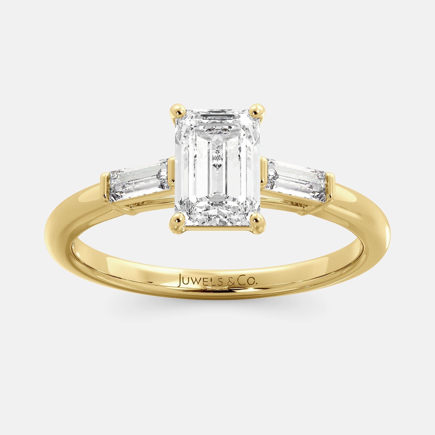 Juwels & Co Emerald Solitaire Diamond Ring With Tapered Baguette Side Stones with yellow gold 14K Band 