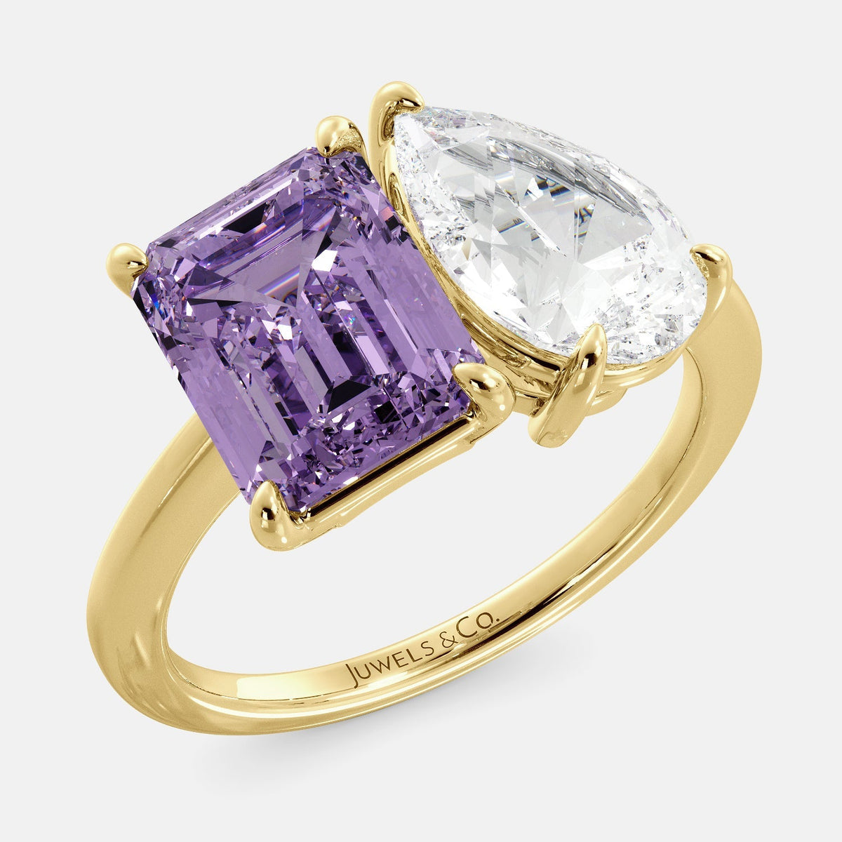 This image shows a toi et moi ring with a pear-shaped white topaz and an emerald-cut amethyst. The ring is set in a 14k yellow gold band and is available in all sizes. The amethyst is a purple gemstone that is said to promote peace, love, and harmony. The white topaz is a clear, colorless stone that is said to promote creativity, imagination, and self-expression. The toi et moi ring is a beautiful and unique way to show your love and commitment to someone special.
