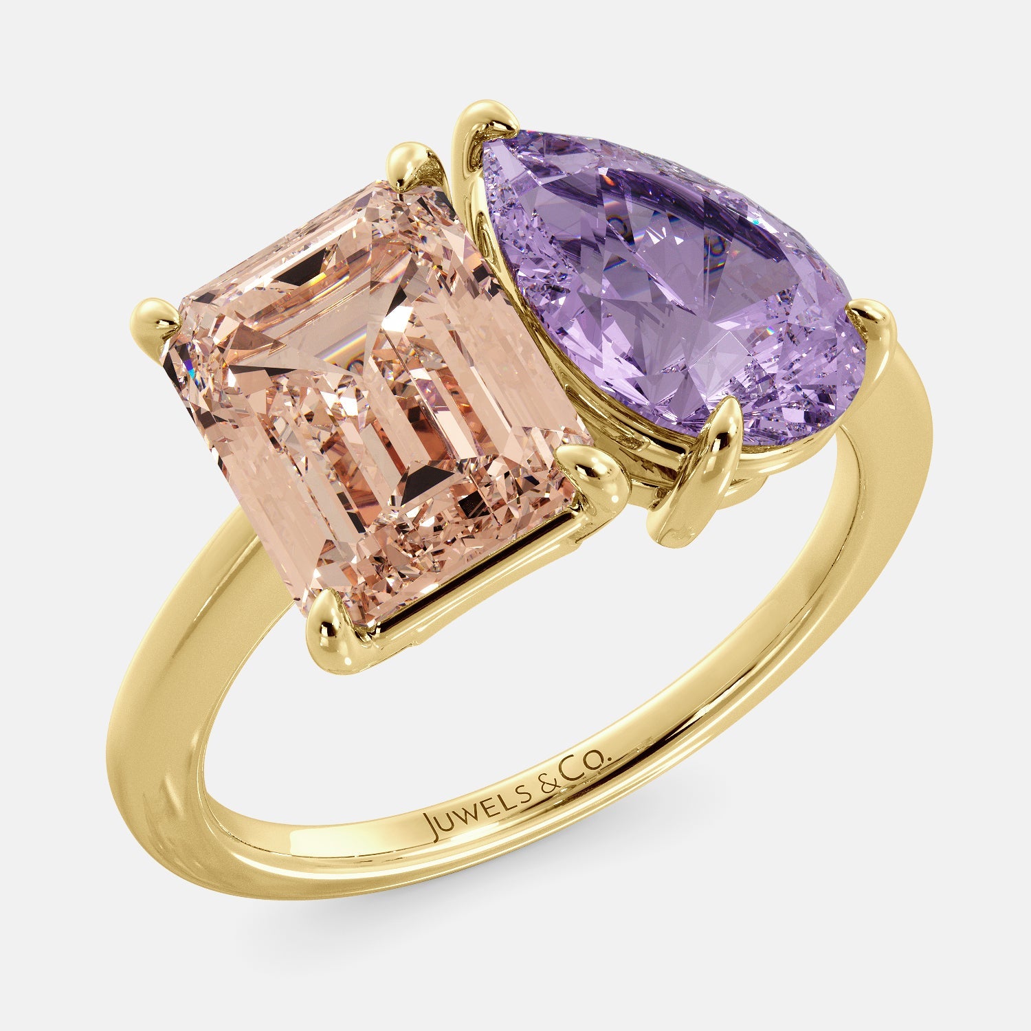 A toi et moi ring with a pear-shaped amethyst and an emerald-cut morganite. The ring is set in a 14k yellow gold band and is available in all sizes. The morganite is a pink gemstone that is said to promote love, compassion, and forgiveness. The amethyst is a purple gemstone that is said to promote peace, love, and harmony. The toi et moi ring is a beautiful and unique way to show your love and commitment to someone special.