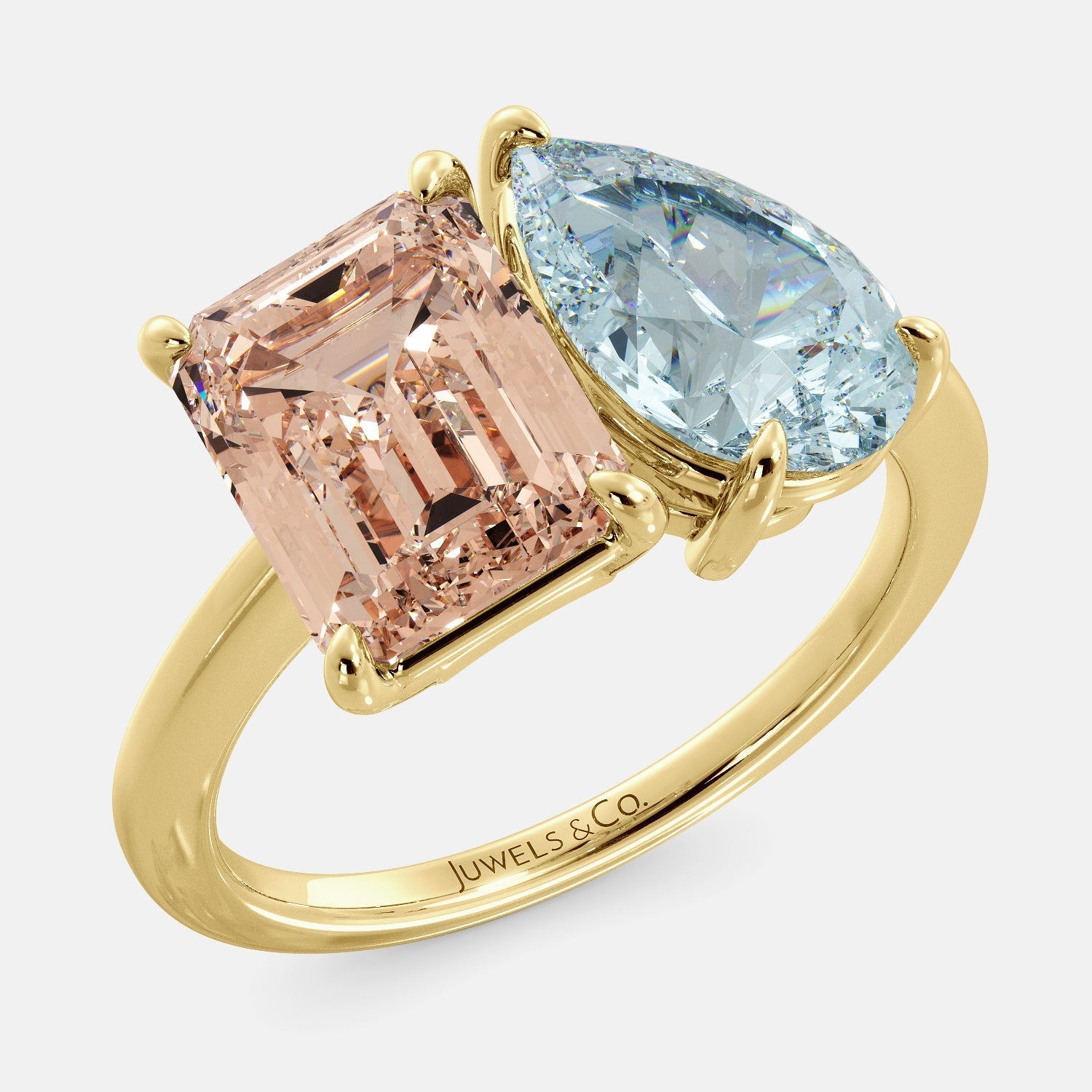 This image shows a toi et moi ring with a pear-shaped aquamarine and an emerald-cut morganite. The ring is set in a 14k yellow gold band and is available in all sizes. The morganite is a pink gemstone that is said to promote love, compassion, and forgiveness. The aquamarine is a blue gemstone that is said to promote spiritual growth and strengthen self-confidence. The toi et moi ring is a beautiful and unique way to show your love and commitment to someone special.