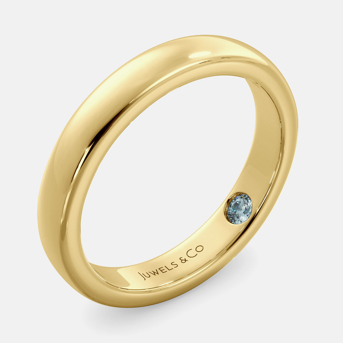 A close-up of a yellow gold flat wedding band with a hidden stone. The band is a classic and timeless design that is perfect for any occasion. The hidden stone can be customized with one of 12 different gemstones, including diamonds, rubies, sapphires, and emeralds. This makes the band a unique and personal choice for the wearer.