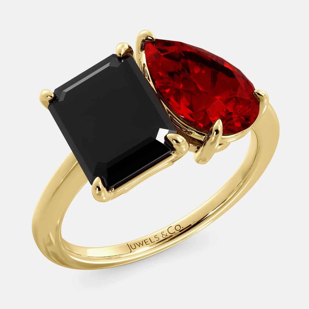 A toi et moi ring with a onyx stone in emerald cut and a pear-shaped stone. The onyx is a deep dark color and the pear-shaped stone can be customized to represent the birth month stone of the wearer or a loved one. The ring is made of 14k gold and is available in all sizes. This ring is a perfect gift for any occasion, and it can be customized to make it truly unique.