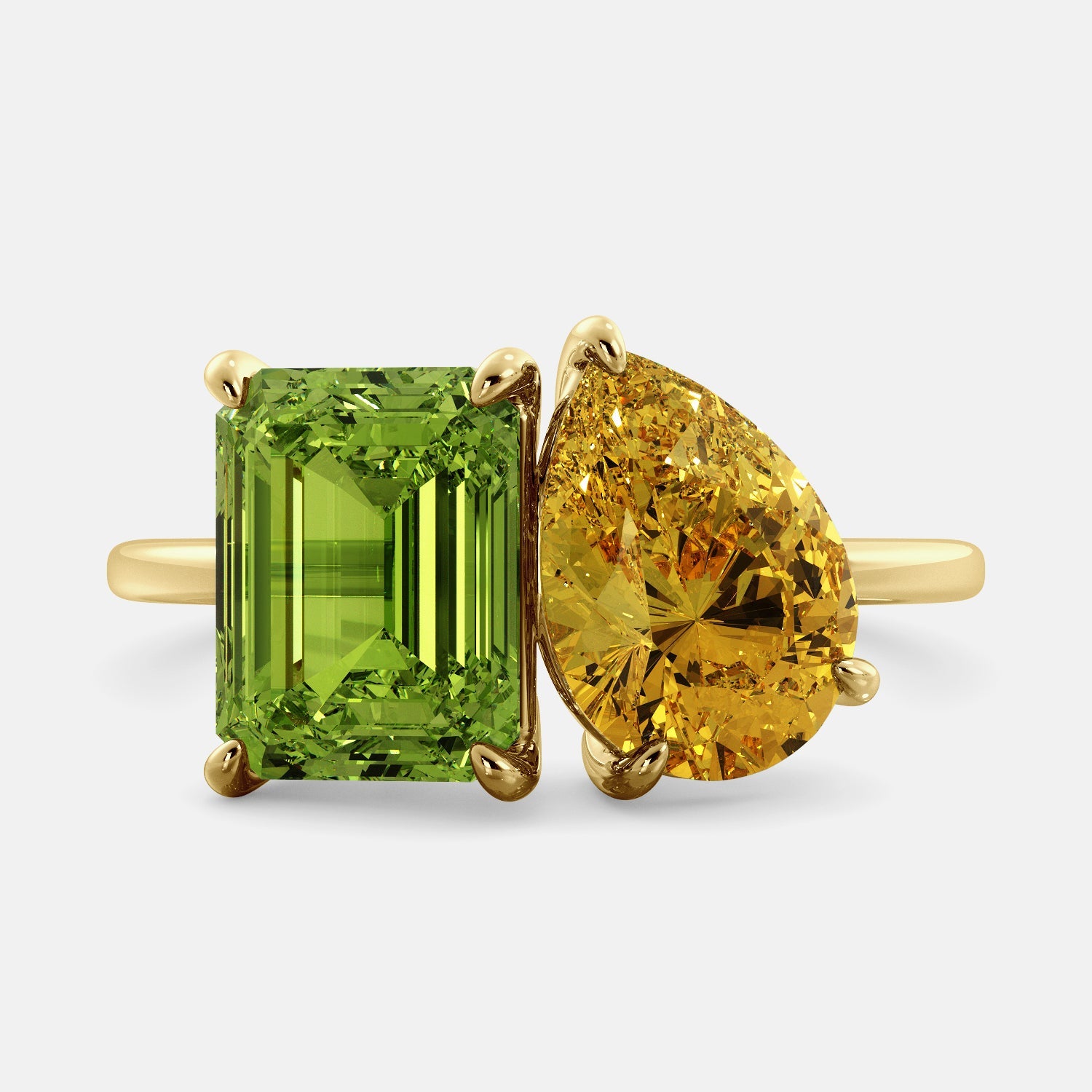 A toi et moi ring with an emerald-cut Green Peridot and a pear-cut gemstone. The emerald-cut morganite is set on the left of the ring, and the pear-cut gemstone is set on the right. The ring is made of recycled yellow gold and has a simple, elegant design. The pear-cut gemstone can be customized. **Here are some additional details about the image:** * The emerald-cut white Green Peridot is a birthstone for August. * The pear-cut gemstone can be customized to any stone of your choice.