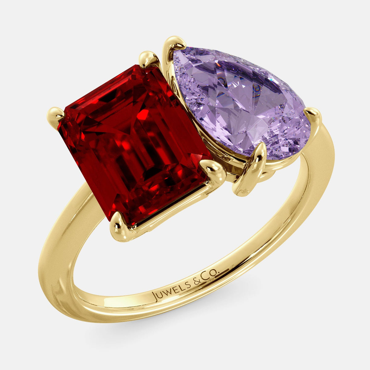 A toi et moi ring with an emerald-cut ruby and a pear-cut gemstone. The emerald-cut morganite is set on the left of the ring, and the pear-cut gemstone is set on the right. The ring is made of recycled yellow gold and has a simple, elegant design. The pear-cut gemstone can be customized. **Here are some additional details about the image:** * The emerald-cut white ruby is a birthstone for July. * The pear-cut gemstone can be customized to any stone of your choice.