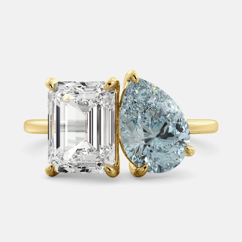 Toi et Moi ring with an emerald-cut Diamond and a pear-cut Aquamarine.
