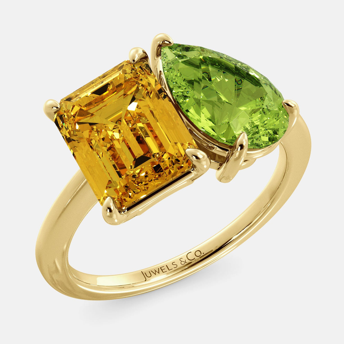 A toi et moi ring with an emerald-cut Citrin and pear-cut gemstone. The emerald-cut morganite is set on the left of the ring, and the pear-cut gemstone is set on the right. The ring is made of recycled yellow gold and has a simple, elegant design. The pear-cut gemstone can be customized. **Here are some additional details about the image:** * The emerald-cut white Citrin is a birthstone for November. * The pear-cut gemstone can be customized to any stone of your choice.