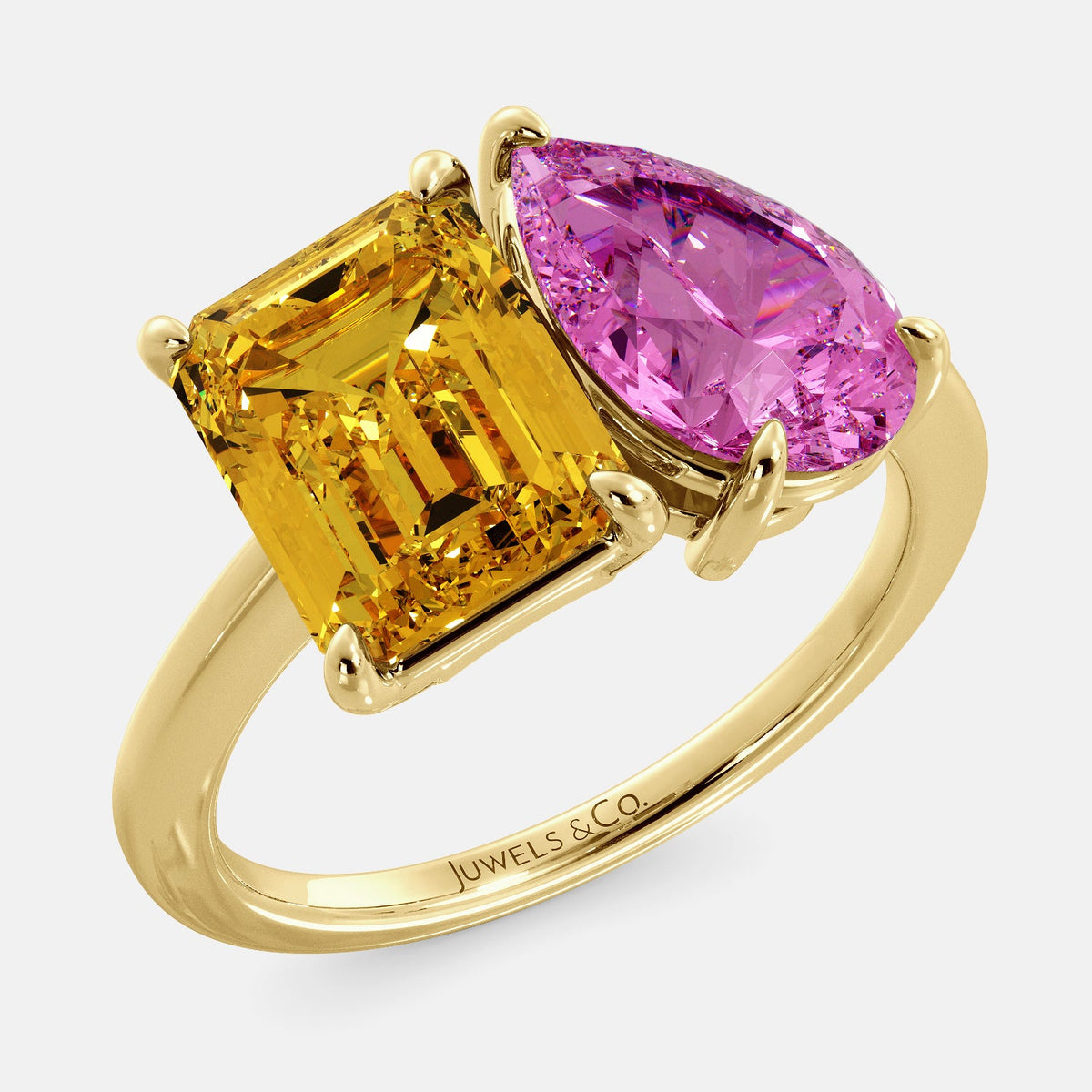 A toi et moi ring with an emerald-cut Citrin and pear-cut gemstone. The emerald-cut morganite is set on the left of the ring, and the pear-cut gemstone is set on the right. The ring is made of recycled yellow gold and has a simple, elegant design. The pear-cut gemstone can be customized. **Here are some additional details about the image:** * The emerald-cut white Citrin is a birthstone for November. * The pear-cut gemstone can be customized to any stone of your choice.